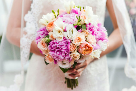 A Bride is Holding Bouquet