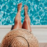 A lady sitting by the pool